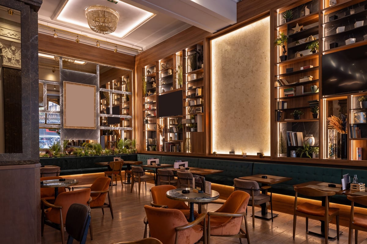 Stylish double-level venue with chandeliers and warm ambient lighting at EMBASSY, Wan Chai