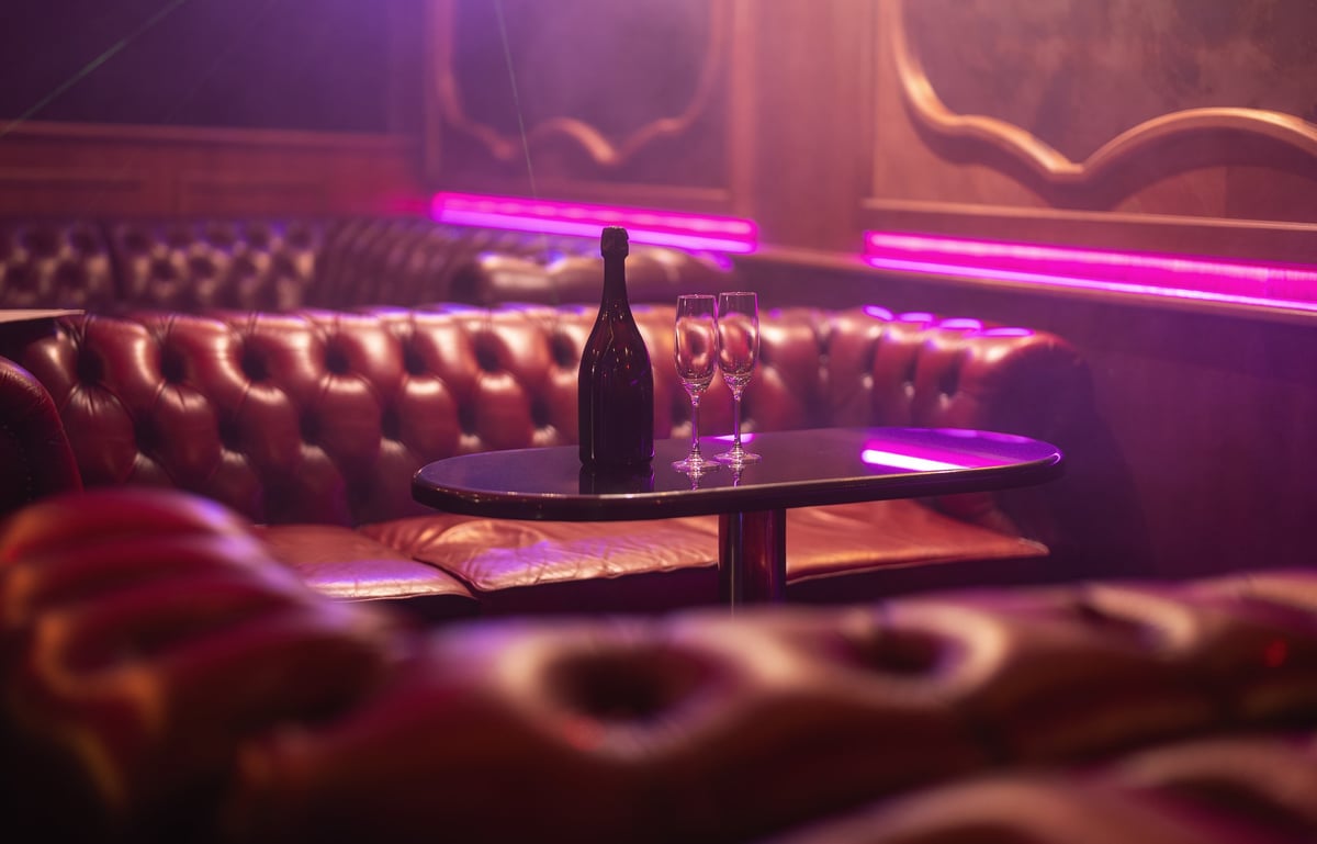 Champagne service on a table in the stylish bar at MINE, Lan Kwai Fong